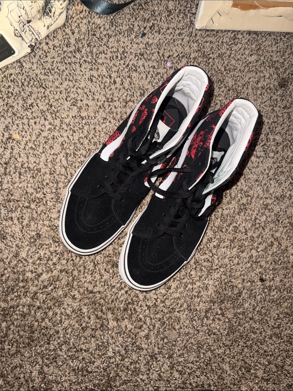 Vans Black Low-Top Sneakers with Red Pattern Accents